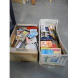 Two boxes of assorted playing cards etc.,