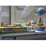 Two tin plate toys - Orbital train and fairground ride.