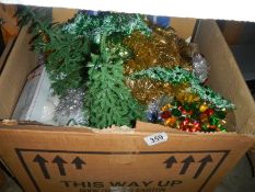 A box of Christmas decorations.