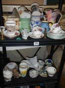 Two shelves of miscellaneous ceramics.