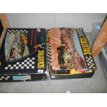 Two boxed Scalextric sets.