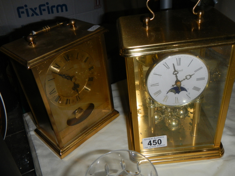 Two brass mantel clocks in working order.