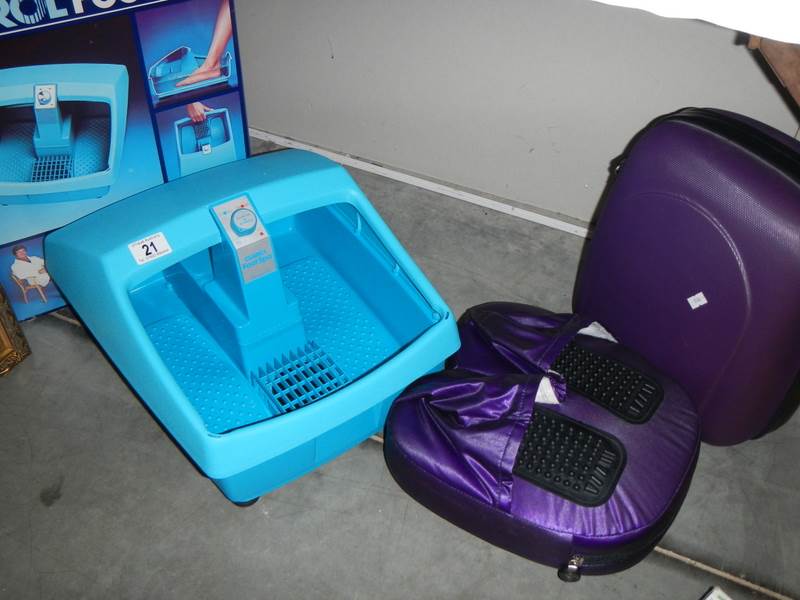 A Clairol foot spa in box and a foot massager in case, both seem to be unused.