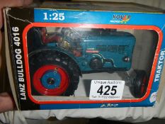 A boxed Lanz Bulldog die cast tractor.