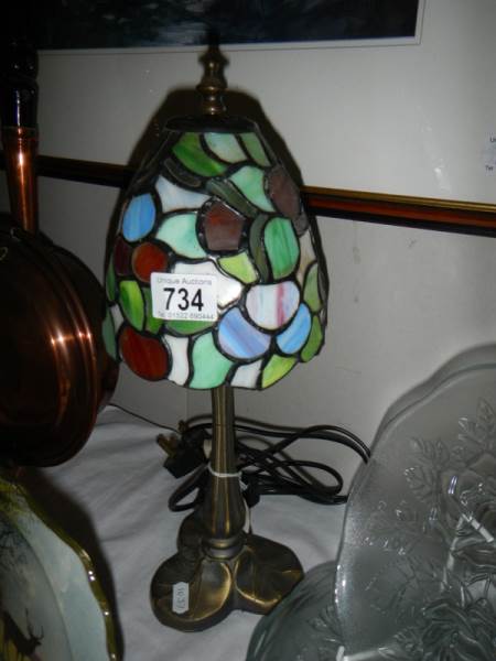 A table lamp with Tiffany style shade.