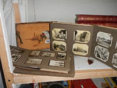 A quantity of old black and white photographs.