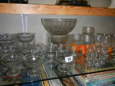 A good lot of vintage dessert dishes and a quantity of drinking glasses.
