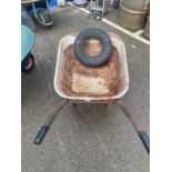 A metal wheel barrow