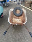 A metal wheel barrow