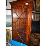 An astral glazed corner cabinet.