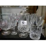 A cut glass decanter and glasses.