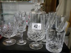 A cut glass decanter and glasses.