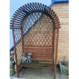 An arched garden seat (one strut on seat a/f)