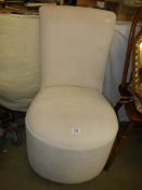 An oyster coloured bedroom chair. COLLECT ONLY.
