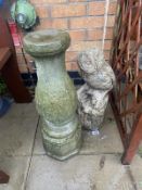 A stone garden owl and stone pedestal