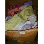 A box of assorted children's clothing.