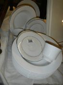A quantity of white ceramic plates, dishes etc.,