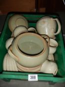 A box of Denby pottery.