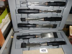 A cased set of new chisels.