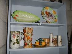 Two shelves of assorted ceramics.