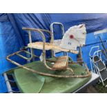 An old metal childs rocking horse