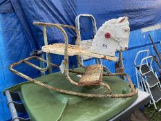 An old metal childs rocking horse