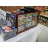 A cabinet of cassettes plus story and comedy tapes.
