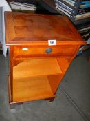 A Yew wood bookcase with drawer.