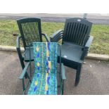 5 green plastic chairs and a folding chair