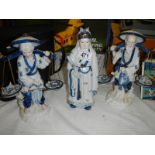 Three Chinese porcelain figures of workers.