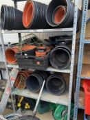 A large quantity of plastic flower pots and a shelf of hose reels and accessories