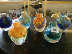Six coloured glass bud vases.
