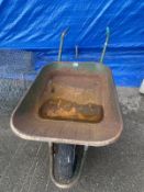 A metal wheel barrow