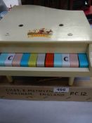 A boxed circa 1950's Pixiano toy piano.
