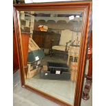 A large mahogany framed bevel edged over mantel mirror. COLLECT ONLY.
