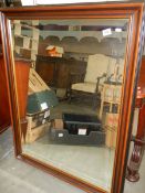 A large mahogany framed bevel edged over mantel mirror. COLLECT ONLY.