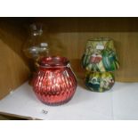 A Tiffany style painted glass tea lamp and two others.