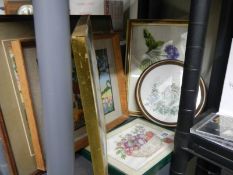 A quantity of framed tapestries.