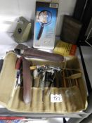 A mixed lot including tool roll with contents, boxed magnifying glass etc.,