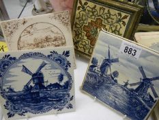 A Victorian brass mounted tile coaster and three others.