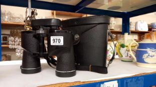 A cased set of Boots 10 x 50 binoculars.