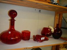 A mixed lot of ruby glass including art glass ashtray, brandy glass with cat and mouse etc.,