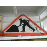 A large vintage road works sign.