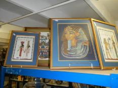 Four framed and glazed Egyptian themed needlework's including King Tutankhamun.