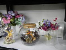 Two floral diorama's under glass, two plastic clock domes and artificial flowers.