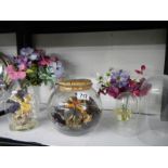 Two floral diorama's under glass, two plastic clock domes and artificial flowers.