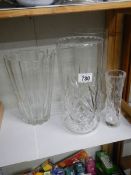 A tall cut glass vase and one other.