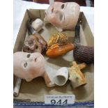 A quantity of vintage pipes, bisque porcelain dolls heads etc.,