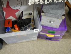 A box of office supplies and filing drawers.