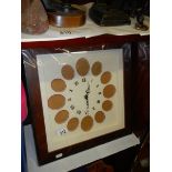 A photo frame wall clock with 12 spaces.
